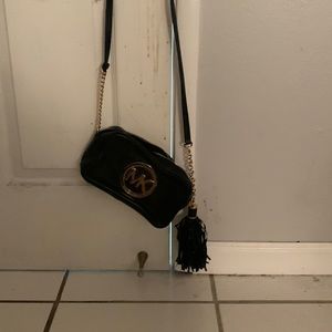 This is a Michael Kors crossbody bag.